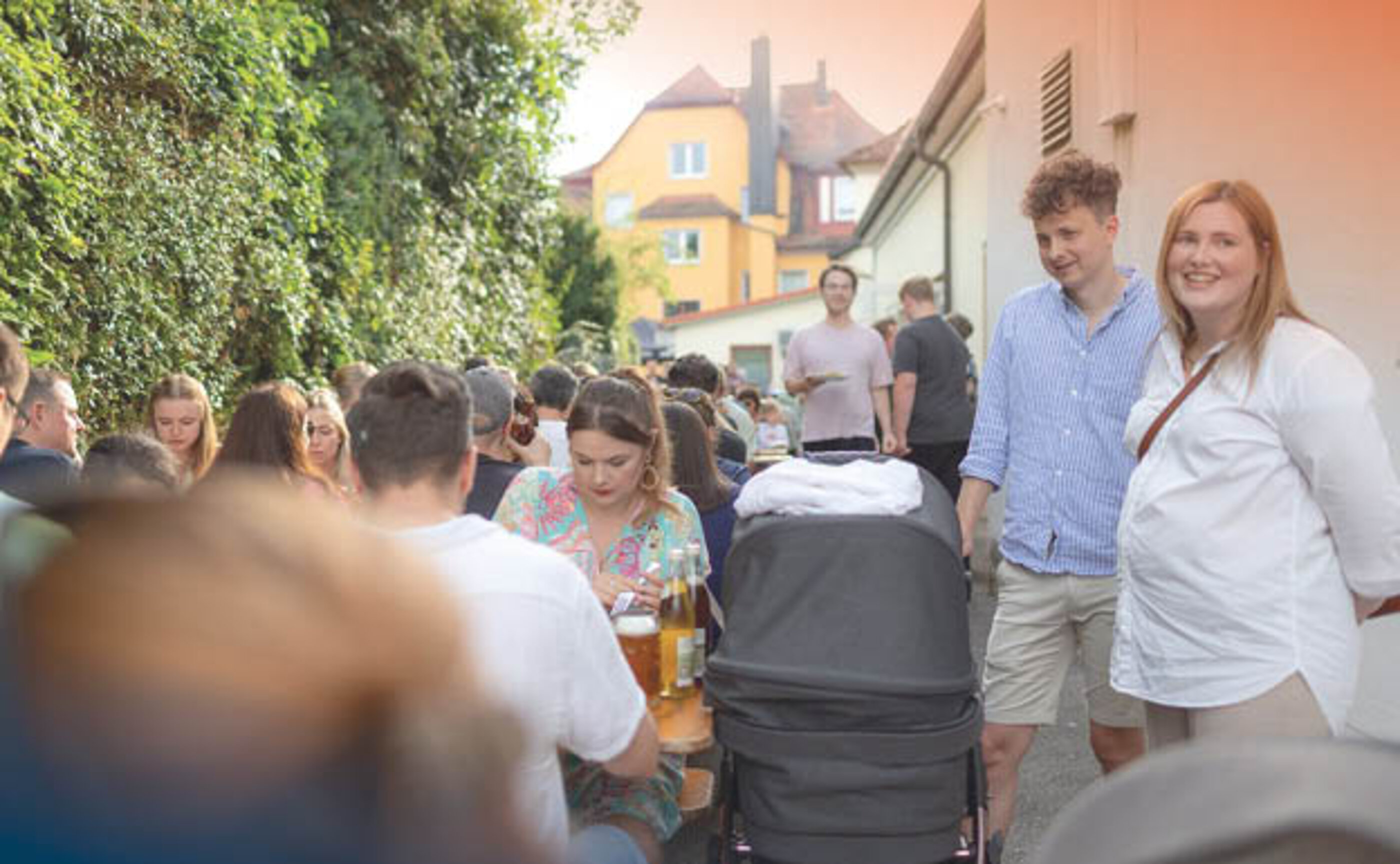 A group of people, some sitting and some standing, at the Marcapo Summer Festival